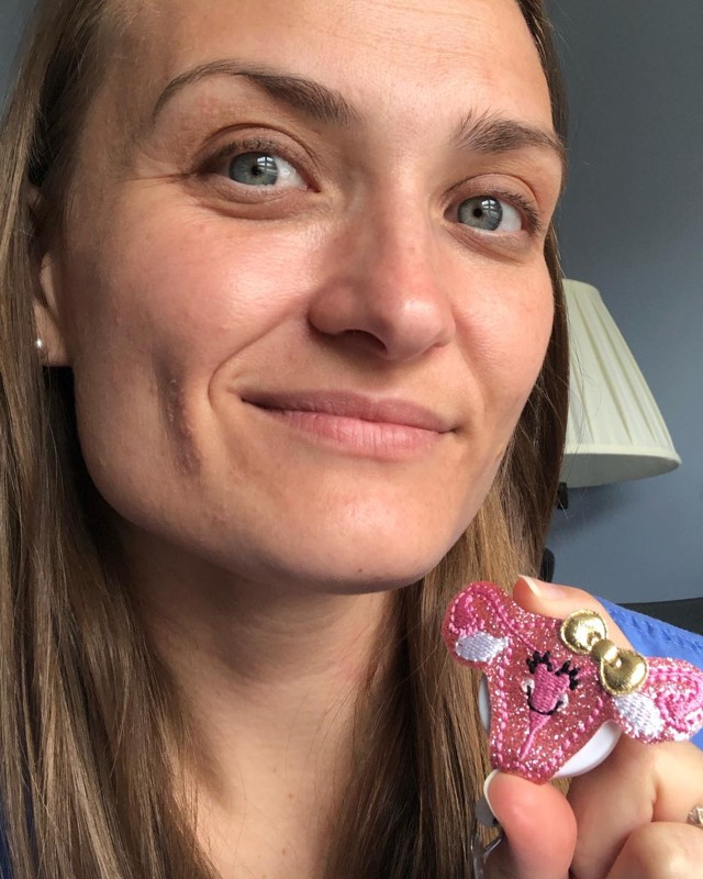 Naomi Whittaker, MD, in surgical scrubs